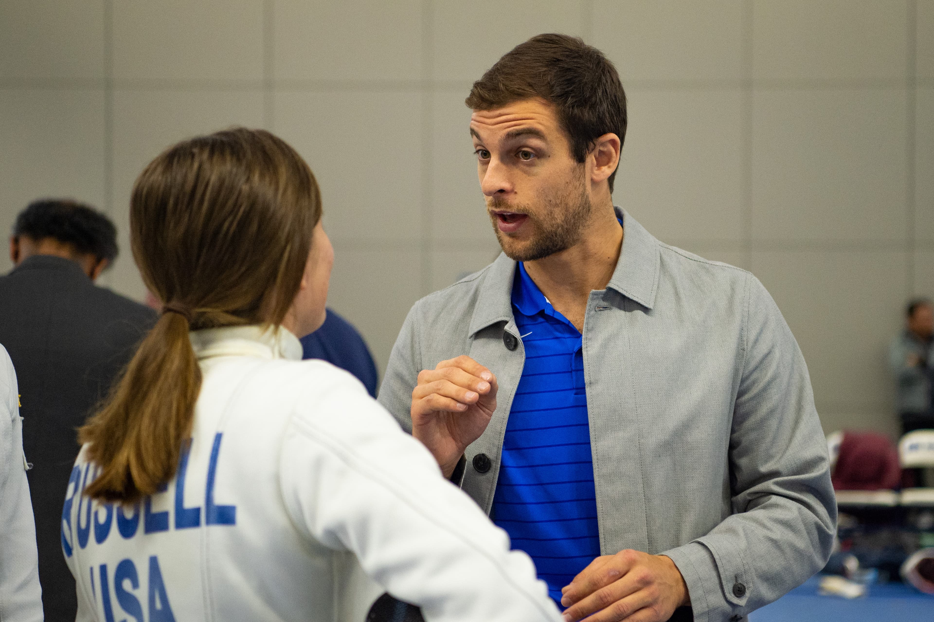 Ari Simmons coaching a Team USA athlete between bouts